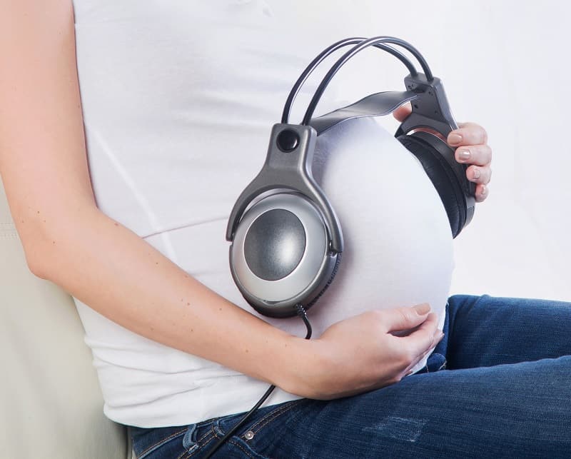 Playing music during pregnancy to stimulate baby's sense of hearing