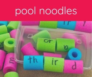 cut pool noodles with letters written on them