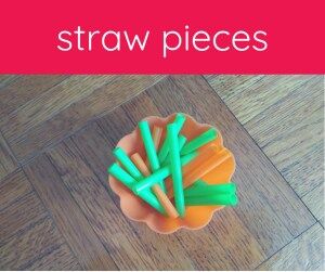 green and orange straw pieces in an orange bowl 