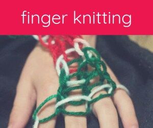 child's hand with yarn knitting