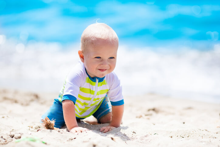 Little baby boy on tropical beach