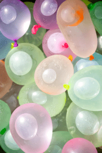 colorful filled water balloons that will freeze and make ice globes for playing with ice