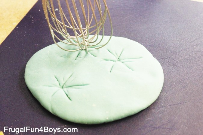 Playdough stamping is part of a collection of autism activities that will help your child learn at home. Build fine motor, communication, imitation and play skills with playdough stamping. | speciallearninghouse.com