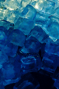 ombre blue ice cubes to explore different colors while playing with ice. ice cubes are dark blue at the bottom and light blue and clear at the top.