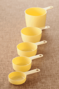 plastic measuring cups to use to scoop and pour ice and water while playing with ice