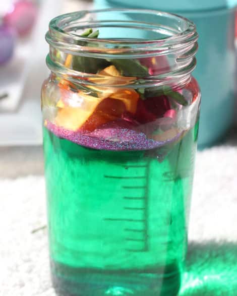 A jar of coloured water layered with glitter and plant bits! It's a fully complete potion!