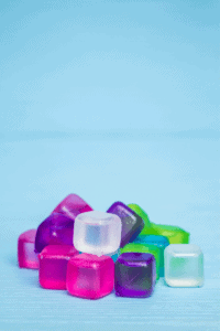 plastic reusable ice cubes that toddlers can explore in an ice play activity