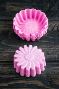 flower shaped silicone cupcake liners to freeze flower shaped ice cubes for playing with ice