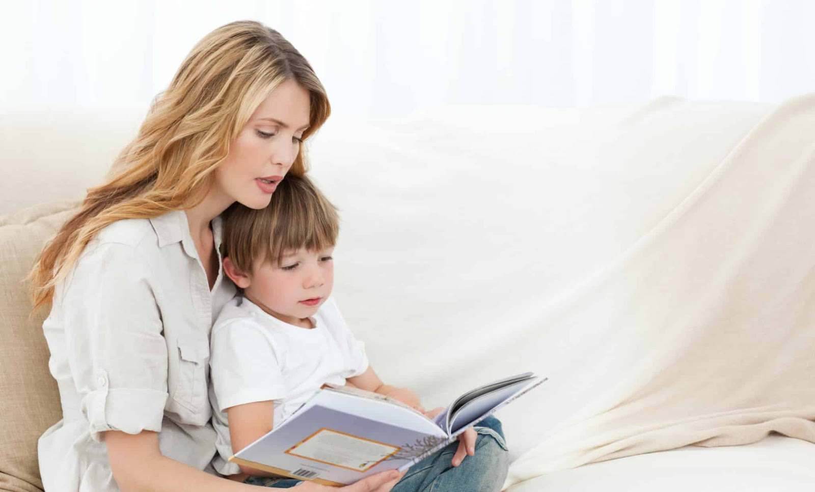 mother reads to a child to help build his language development